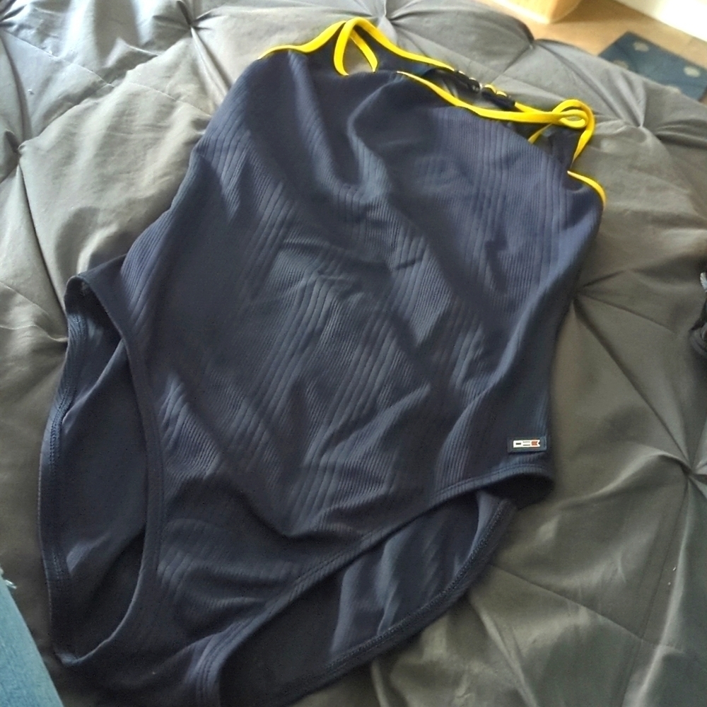 One piece navy swimsuit with built-in bra.